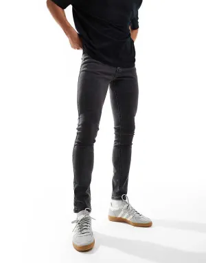 COLLUSION mid rise skinny jeans in washed black